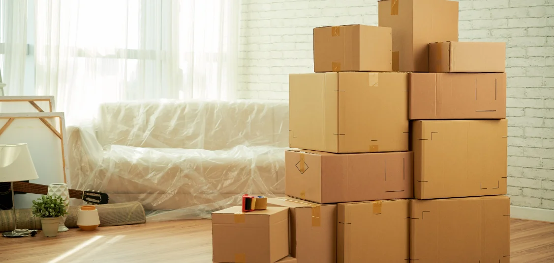 Stacked moving boxes inside a room